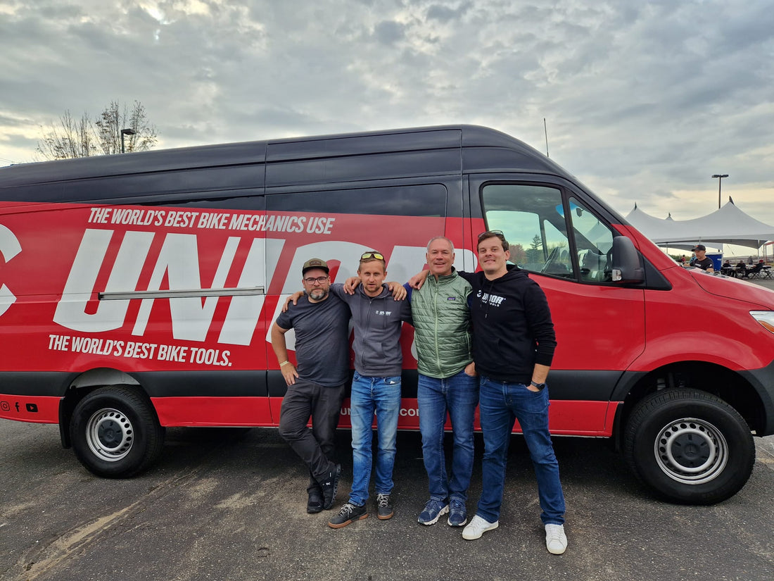 Trek CX Cup Waterloo, four bike mechanics standing in front of the red Unior tool van with the brand wordmark