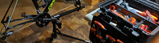 Cannondale road bike on a workstand beside an open Unior tool case, header image for the Crushar in the Tushar dispatch