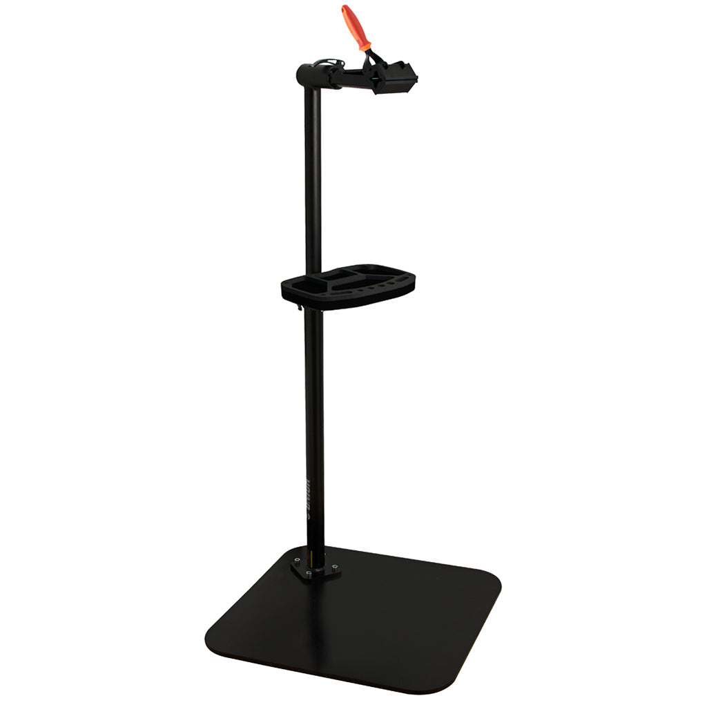 Unior 1693BS Single Arm Professional Repair Stand: a freestanding shop stand with quick-release clamp, tool tray, and stable cast base, representative of the single-arm shop-stand archetype covered in this buying guide.