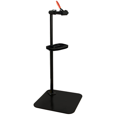 Unior 1693BS Single Arm Professional Repair Stand: a freestanding shop stand with quick-release clamp, tool tray, and stable cast base, representative of the single-arm shop-stand archetype covered in this buying guide.