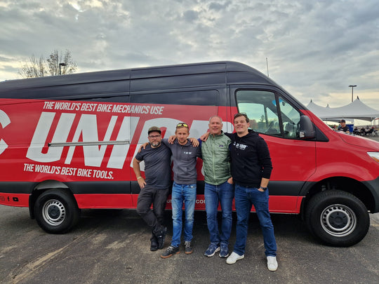 Trek CX Cup Waterloo, four bike mechanics standing in front of the red Unior tool van with the brand wordmark