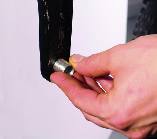 Threading a steel pedal thread insert into a crank arm to restore stripped pedal threads