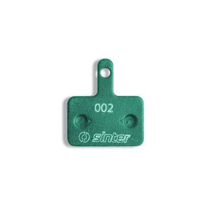Sinter Green s2032 Model 002 disc brake pad backplate stamped 002 with Sinter logo, Shimano B Type fitment