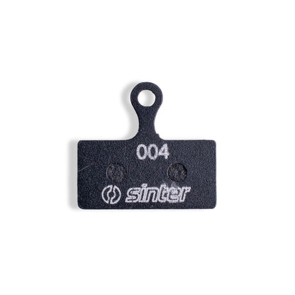 Sinter Black 004 disc brake pad back plate with 004 model stamp and Sinter logo, fits Shimano XTR XT SLX G/L Type