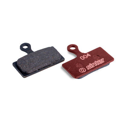 Sinter Red s004 organic disc brake pad next to worn black pad, for Shimano XTR, XT and SLX G/L Type calipers