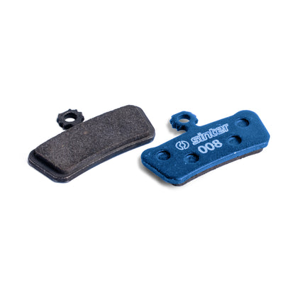 Sinter Blue s008 organic disc brake pad next to worn black pad, for SRAM G2, Guide and Trail calipers