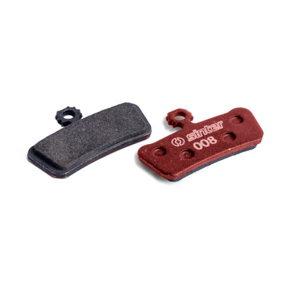 Sinter Red s008 organic disc brake pad next to worn black pad, for SRAM G2, Guide and Trail calipers