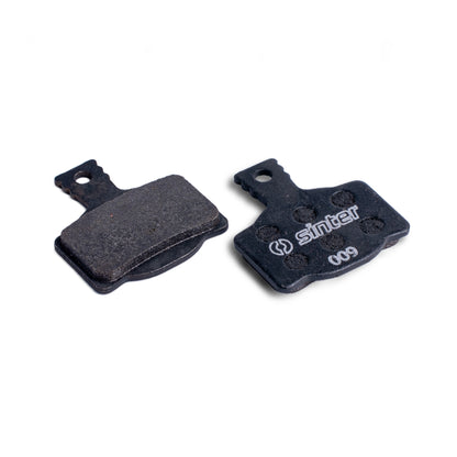 Sinter Model 009 Black organic disc brake pad pair showing friction face and dimpled backplate for Magura calipers