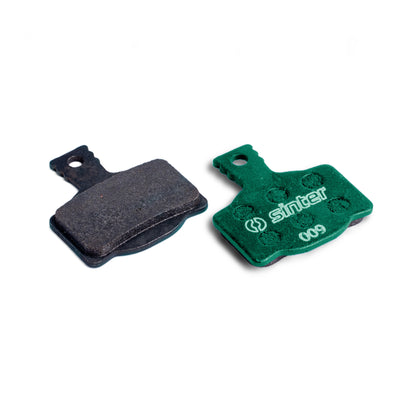 Sinter Model 009 Green organic disc brake pad pair showing friction face and dimpled backplate for Magura calipers