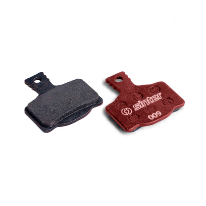 Sinter Model 009 Red organic disc brake pad pair showing friction face and dimpled backplate for Magura calipers
