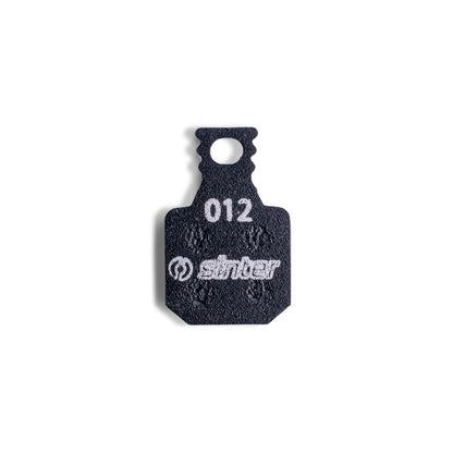 Sinter Model 012 Magura black brake pad, single backplate-up view stamped with model code 012 and the sinter wordmark