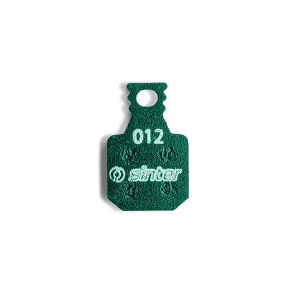 Sinter Model 012 Magura green brake pad, single backplate-up view stamped with model code 012 and the sinter wordmark
