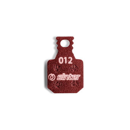 Sinter Model 012 Magura red brake pad, single backplate-up view stamped with model code 012 and the sinter wordmark