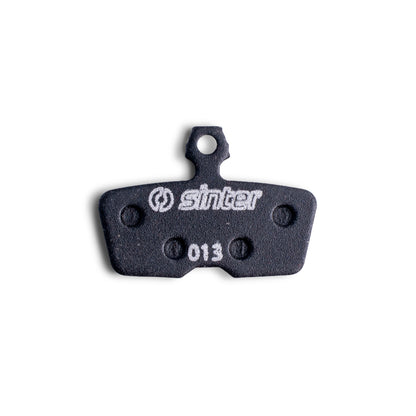 Sinter Black s550 disc brake pad close-up for SRAM Code and Avid, model 013 stamped on backing plate