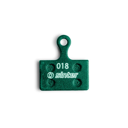 Sinter Green 018 Shimano K Type disc brake pad, organic compound front face with model 018 stamp