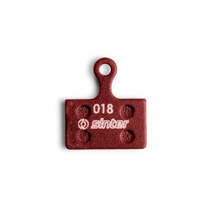 Sinter Red 018 Shimano K Type disc brake pad, organic compound front face with model 018 stamp
