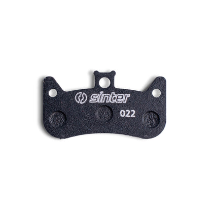 Sinter Model 022 disc brake pad close-up in black endurance compound, four-piston pad stamped 022 for Formula Cura 4
