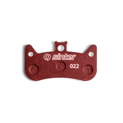 Sinter Model 022 disc brake pad close-up in red sport compound, four-piston pad stamped 022 for Formula Cura 4