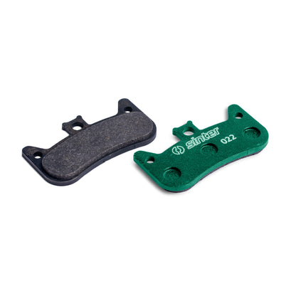 Sinter Model 022 disc brake pads, green race compound shown next to worn black pad for Formula Cura 4 calipers
