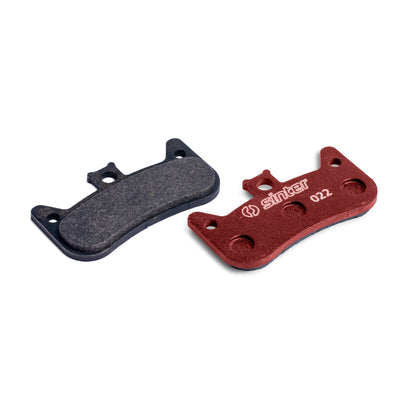 Sinter Model 022 disc brake pads, red sport compound next to worn pair, organic pads for Formula Cura 4 calipers