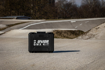 Unior BMX Tool Kit 1600BMX closed heavy-duty composite case standing on a BMX race track
