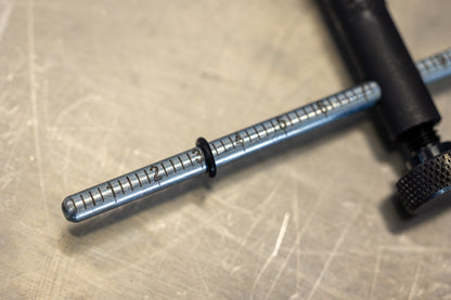 Hanger Genie 2.0 gauge rod close-up, etched scale markings 1 through 5 used for derailleur hanger alignment