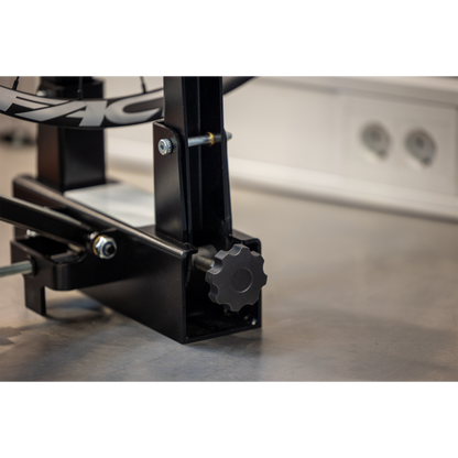 Pro Truing Stand 1689 base close-up, black knurled knob and threaded shaft for adjusting upright tension