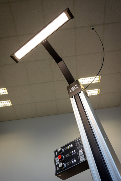 Electric Repair Stand 2.0 LED worklight extended above the column, control panel showing upper, current and lower height limits