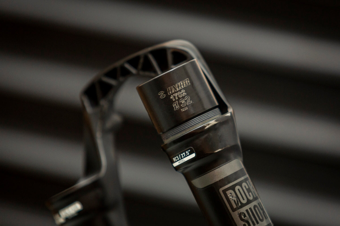 Unior 1702 Ø32 fork seal driver seated on a RockShox RC3 27.5-inch suspension fork stanchion during dust-seal installation