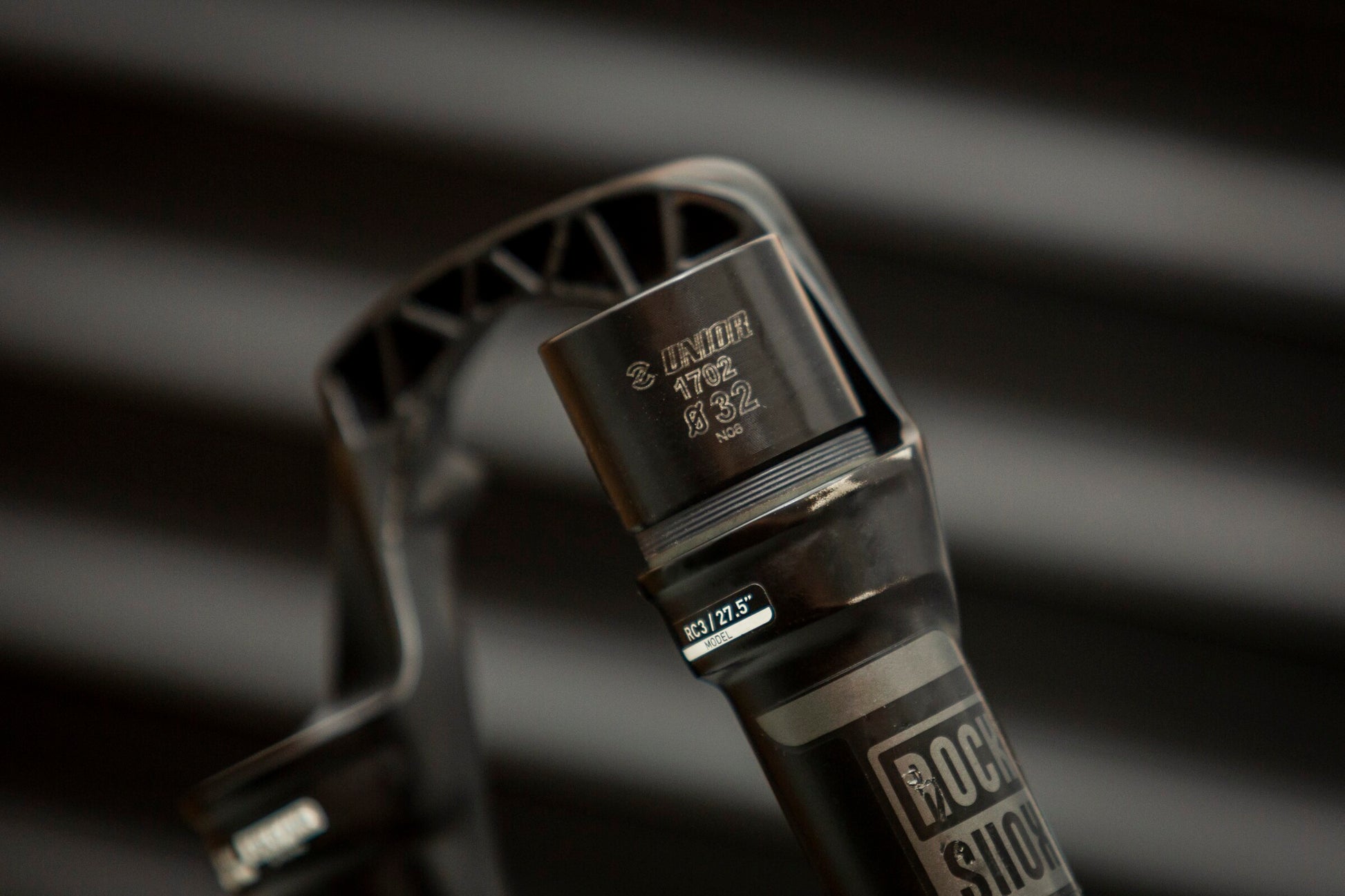 Unior 1702 Ø32 fork seal driver seated on a RockShox RC3 27.5-inch suspension fork stanchion during dust-seal installation