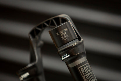 Unior 1702 Ø32 fork seal driver seated on a RockShox RC3 27.5-inch suspension fork stanchion during dust-seal installation
