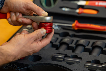 Red Unior 1783 socket fitted to a ratchet handle, Suspension Service Set 2.0 case in background