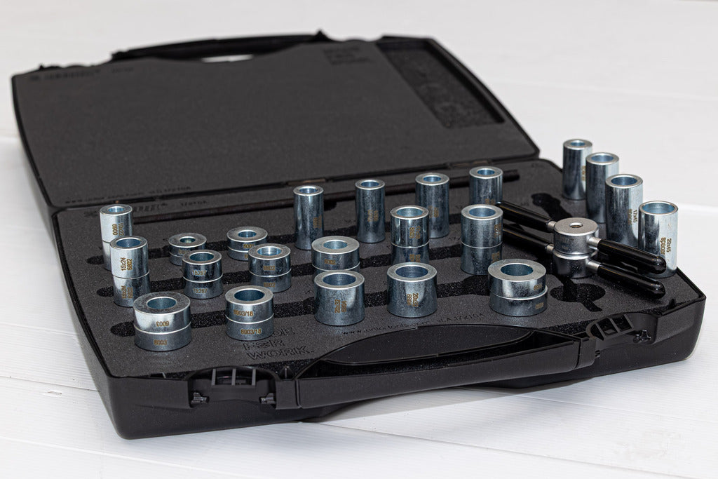 Over Axle Bearing Press Set case with steel press drifts and drawbar handles laid out across the foam tray