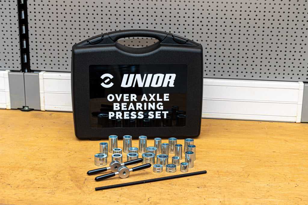 Closed Unior Over Axle Bearing Press Set case with press drifts and drawbar arranged on a workshop bench