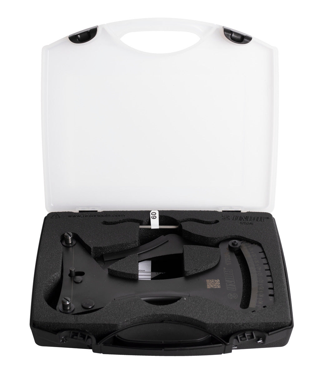 Unior Spoke Tension Meter 2.0 seated in its foam-lined carry case beside the calibration rod