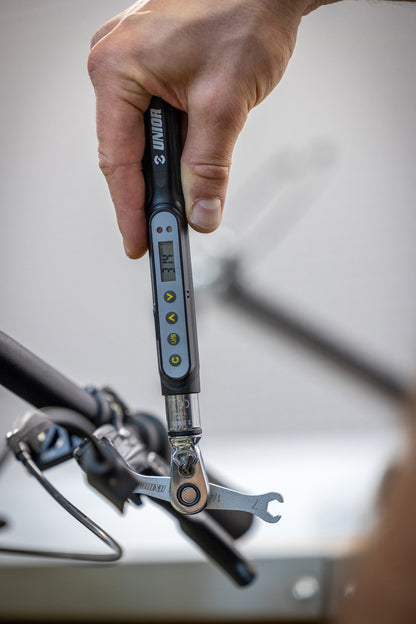 Unior digital torque wrench reading 3.4 Nm paired with the 1760/2 flare nut wrench on a bicycle brake hose fitting