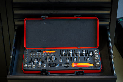 Unior Master Bits and Sockets Set open inside a black tool cabinet drawer, foam tray of bits, sockets and ratchet