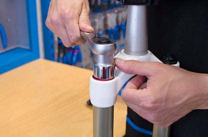 Unior 1783/1 6P flat socket on a 1/2-inch ratchet loosening a suspension fork top cap