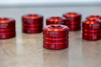 Unior 1783 Suspension Top Cap Socket size 28 in foreground on workshop bench, additional sockets from the set behind