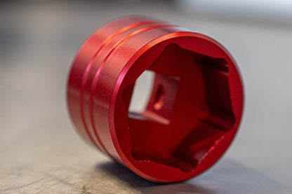 Unior 1783 Suspension Top Cap Socket close-up, hex interior of the red anodized aluminium socket for fork top caps
