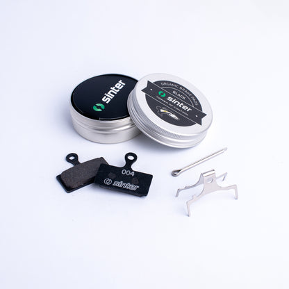 Sinter Black 004 organic brake pad pair with aluminum tin, spring clip and retaining pin for Shimano XTR XT SLX