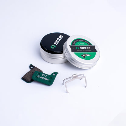 Sinter Green 017 organic brake pads with stainless spring clip and aluminum storage tin, SRAM road fit