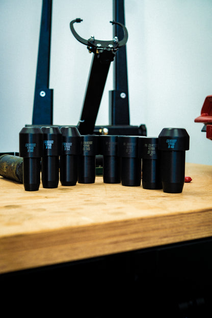 Unior 1702 fork seal driver bundle, black drivers stamped with size codes standing on a workshop bench