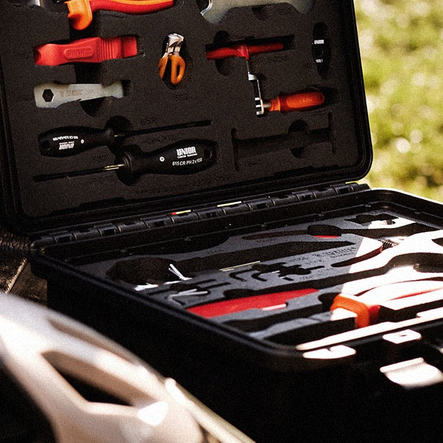Open Unior bicycle tool kit case with tools in foam inserts