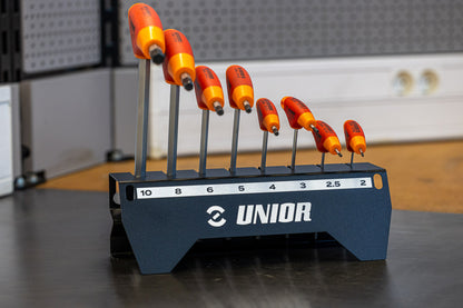 Unior 193HX-US.1 T-handle hex wrench set on the bench, eight red-and-orange wrenches in a labeled metal holder marked 10 through 2 mm