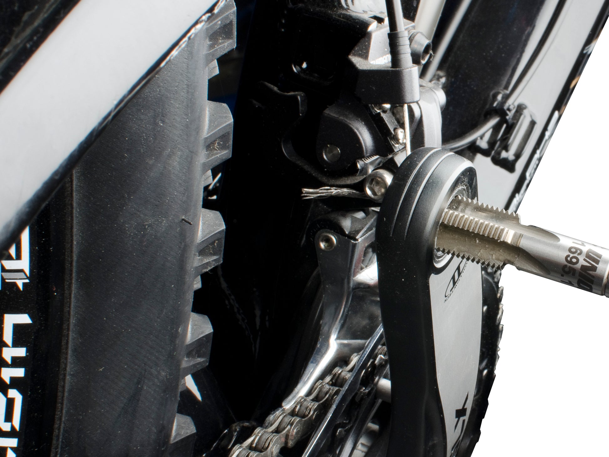 Unior 1695.1 pedal tap threaded into a crank arm pedal eye, restoring the 9/16 inch pedal thread