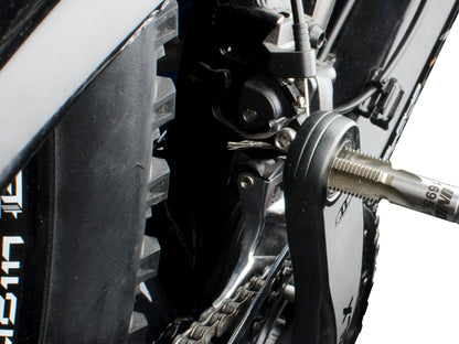 Unior 1695.1 pedal tap threaded into a crank arm pedal eye, restoring the 9/16 inch pedal thread