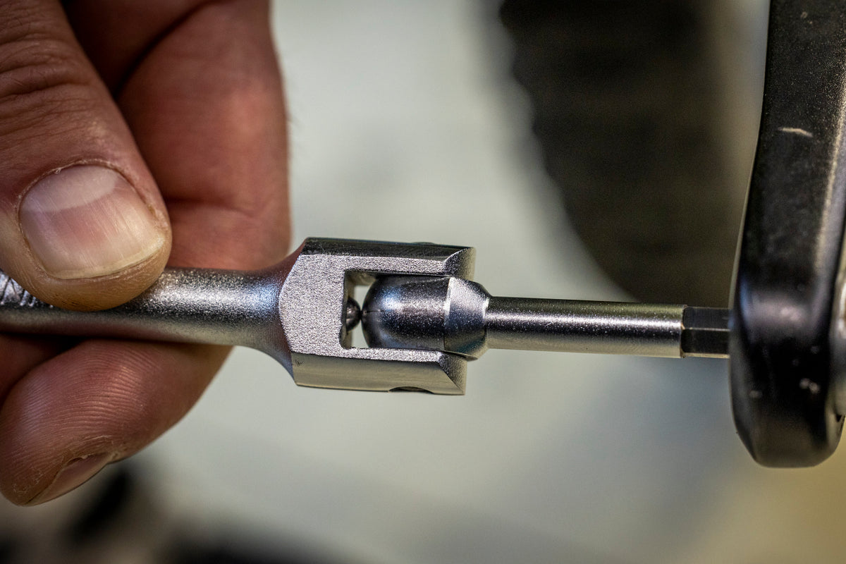 Close-up of the Unior Speed Pedal Wrench 1613S/1BI swivel joint with the hex bit seated in a clipless pedal spindle
