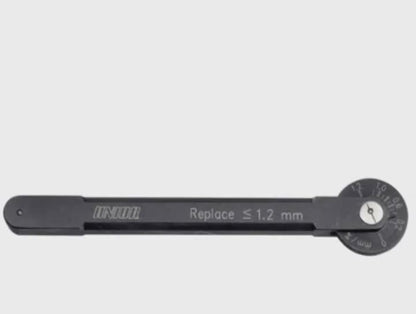 Unior 1643 chain wear indicator product video — checking chain wear on the bike, reading the swing-arm dial in millimeters