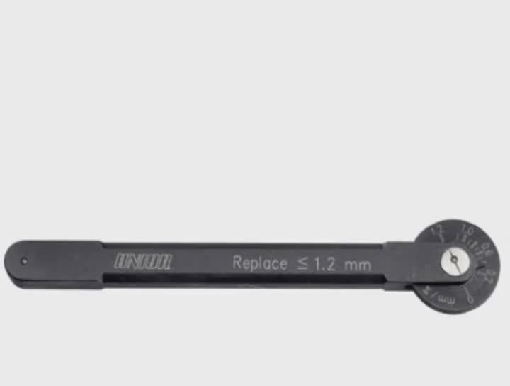 Unior 1643 chain wear indicator product video — checking chain wear on the bike, reading the swing-arm dial in millimeters